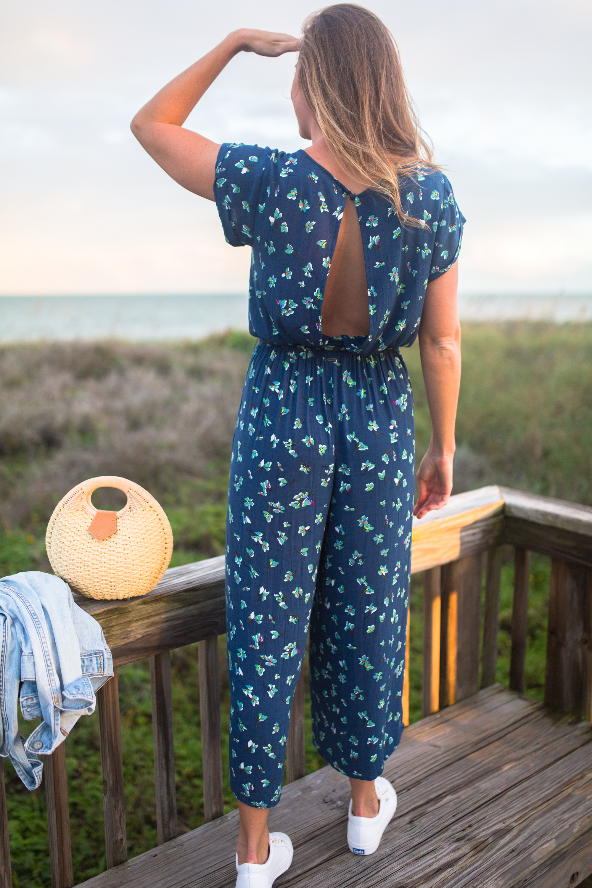 What to Wear on a Tropical Winter Getaway / Blue Floral Jumpsuit / Beach Resort Outfits / Resort Vacation Outfits / Vacay Outfits / Island Outfits Tropical / Beach Weekend Outfit / White Sneakers Outfit - Sunshine Style, A Florida Based Fashion and Lifestyle Blog