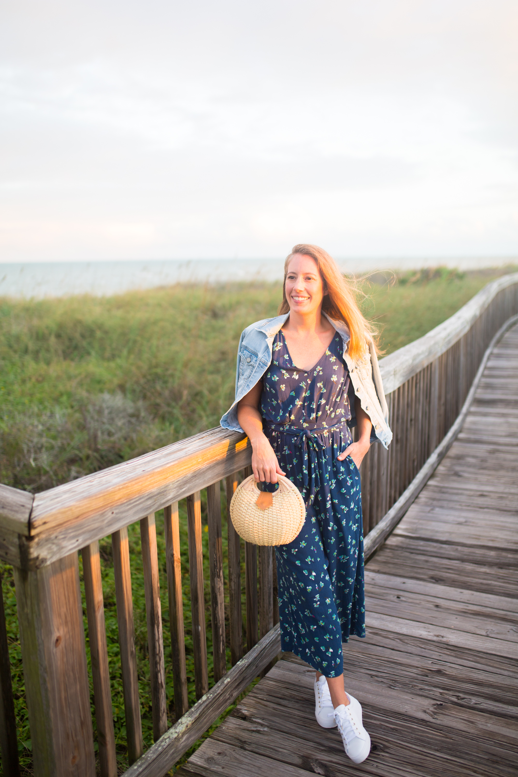 What to Wear on a Tropical Winter Getaway / Blue Floral Jumpsuit / Beach Resort Outfits / Resort Vacation Outfits / Vacay Outfits / Island Outfits Tropical / Beach Weekend Outfit / White Sneakers Outfit - Sunshine Style, A Florida Based Fashion and Lifestyle Blog