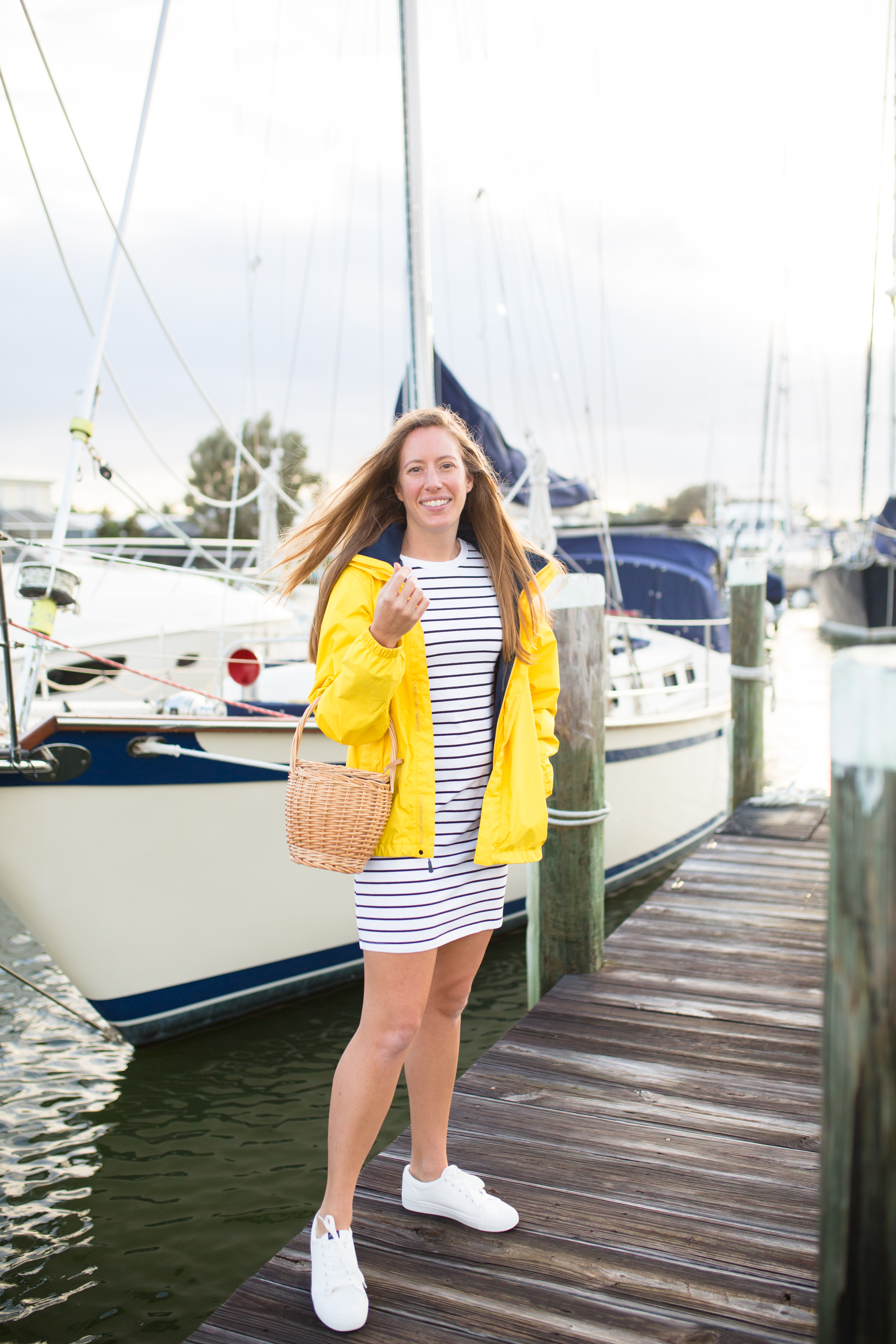 How to Style a Long Sleeve Striped Dress / Striped Dress Outfit / Blue Stripes / Yellow Raincoat / White Sneakers / Preppy Outfit / Coastal Outfit / Preppy Style Outfit / Cute Preppy Outfits / Nautical Outfit Women - Sunshine Style, A Florida Fashion and Lifestyle Blog