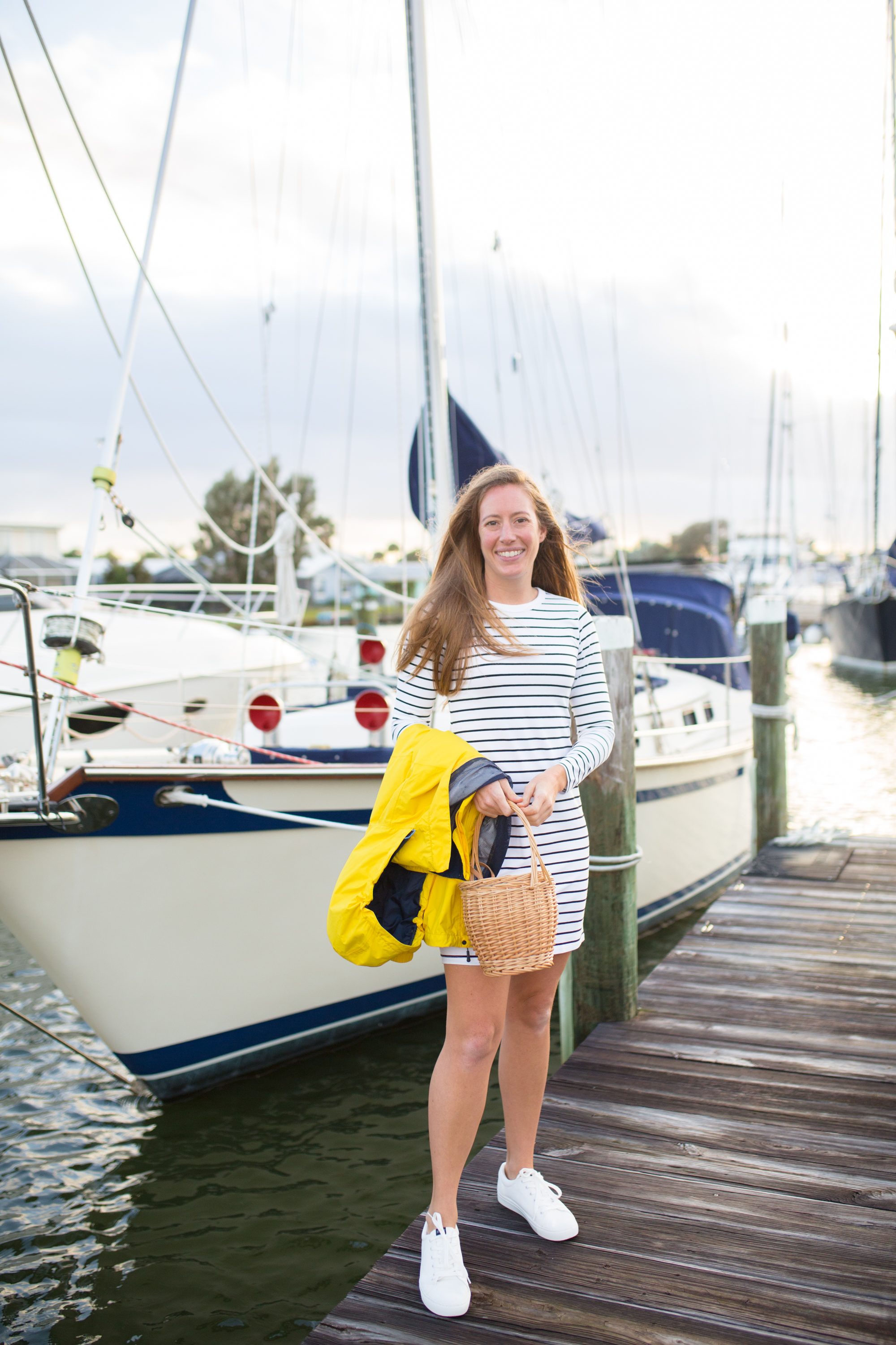 How to Style a Long Sleeve Striped Dress / Striped Dress Outfit / Blue Stripes / Yellow Raincoat / White Sneakers / Preppy Outfit / Coastal Outfit / Preppy Style Outfit / Cute Preppy Outfits / Nautical Outfit Women - Sunshine Style, A Florida Fashion and Lifestyle Blog