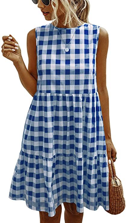 woman wearing a gingham dress, a bag, and wearing sunglasses