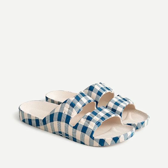 a pair of sandals with blue gingham print